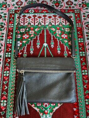 Roots Pebbled Prince Leather Foldover Crossbody With a Tassel- BLACK